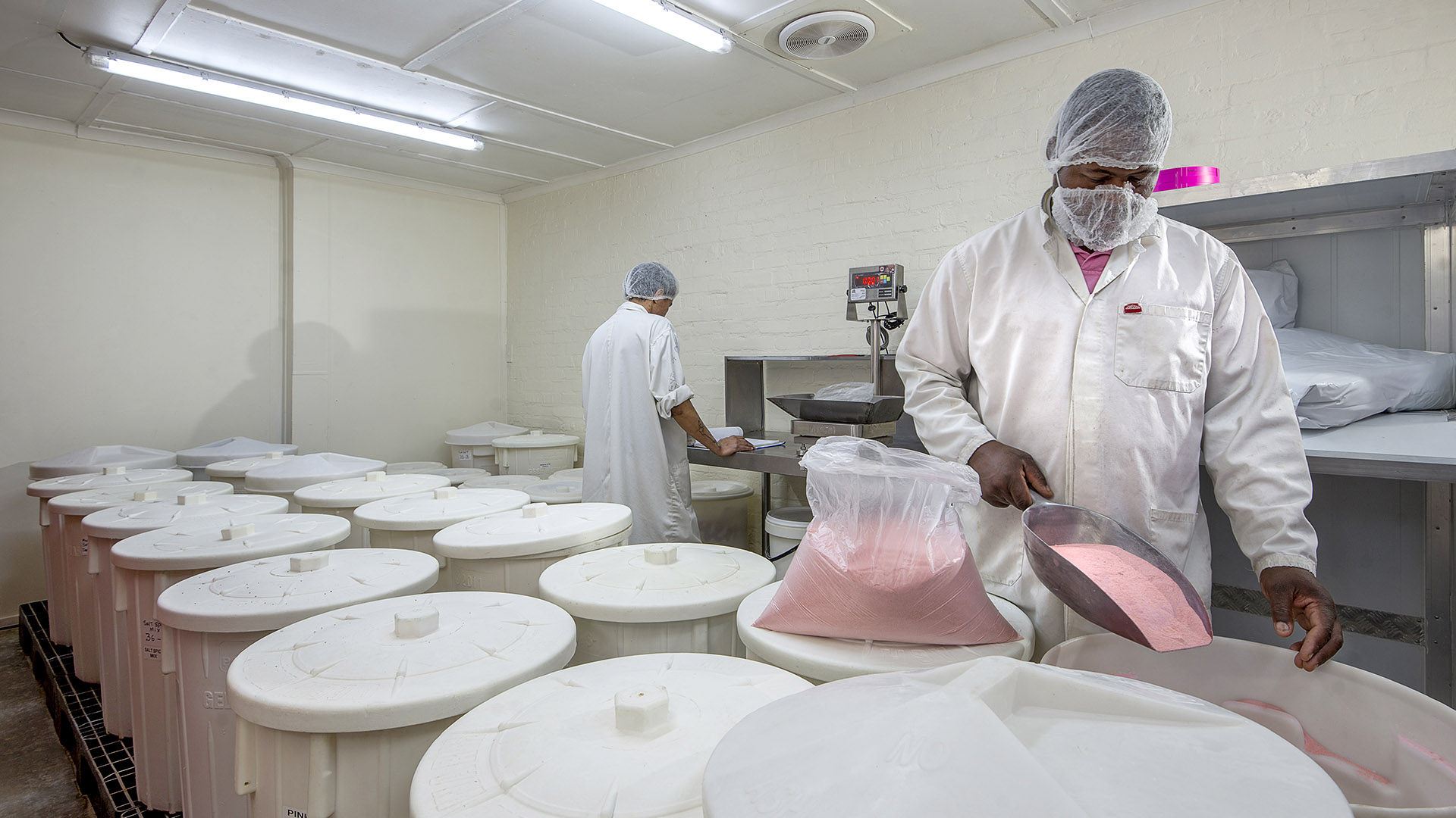 Feinschmecker curing team preparing traditional dry-cure salt mix